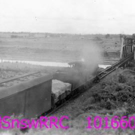 UP GOODS TRAIN APPROACHING BRIDGE OVER HUNTER RIVER, OAKHAMPTON, NSW, 8 FEBRUARY 1957
